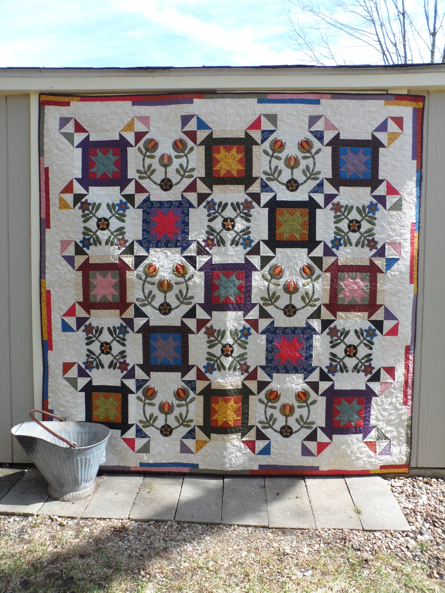 Scrappy lap quilt pattern with applique