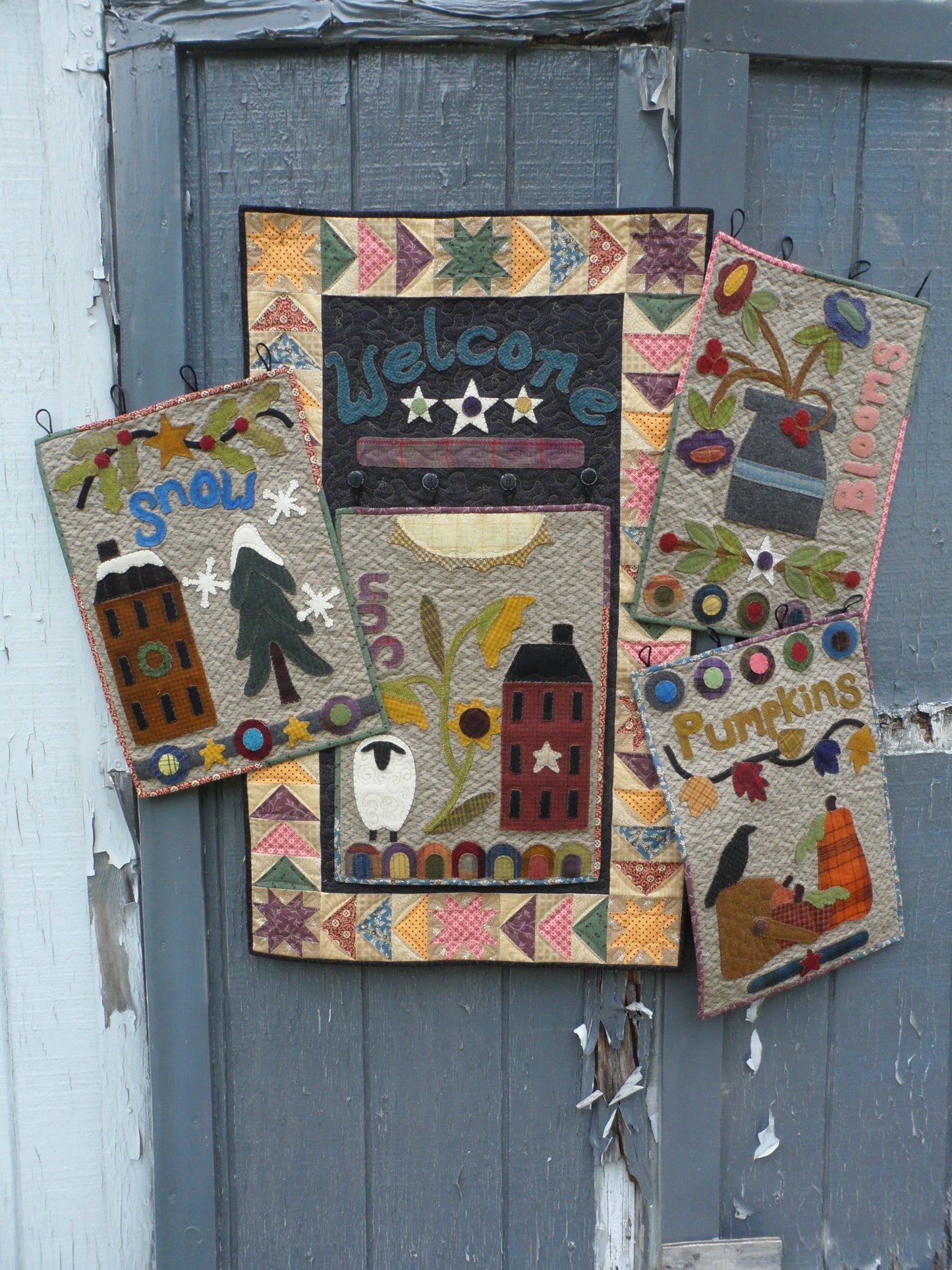 Wool applique on fabric wall hanging quilt pattern