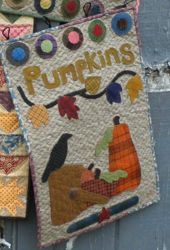 Wool applique on fabric wall hanging quilt pattern