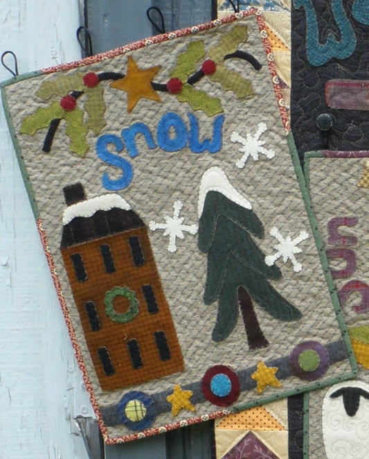 Wool applique on fabric wall hanging quilt pattern