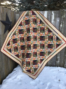 Scrappy lap quilt pattern designed by Deanne Eisenman for Snuggles Quilts