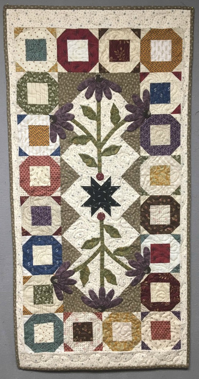 scrappy table runner quilt pattern with applique charm square friendly
