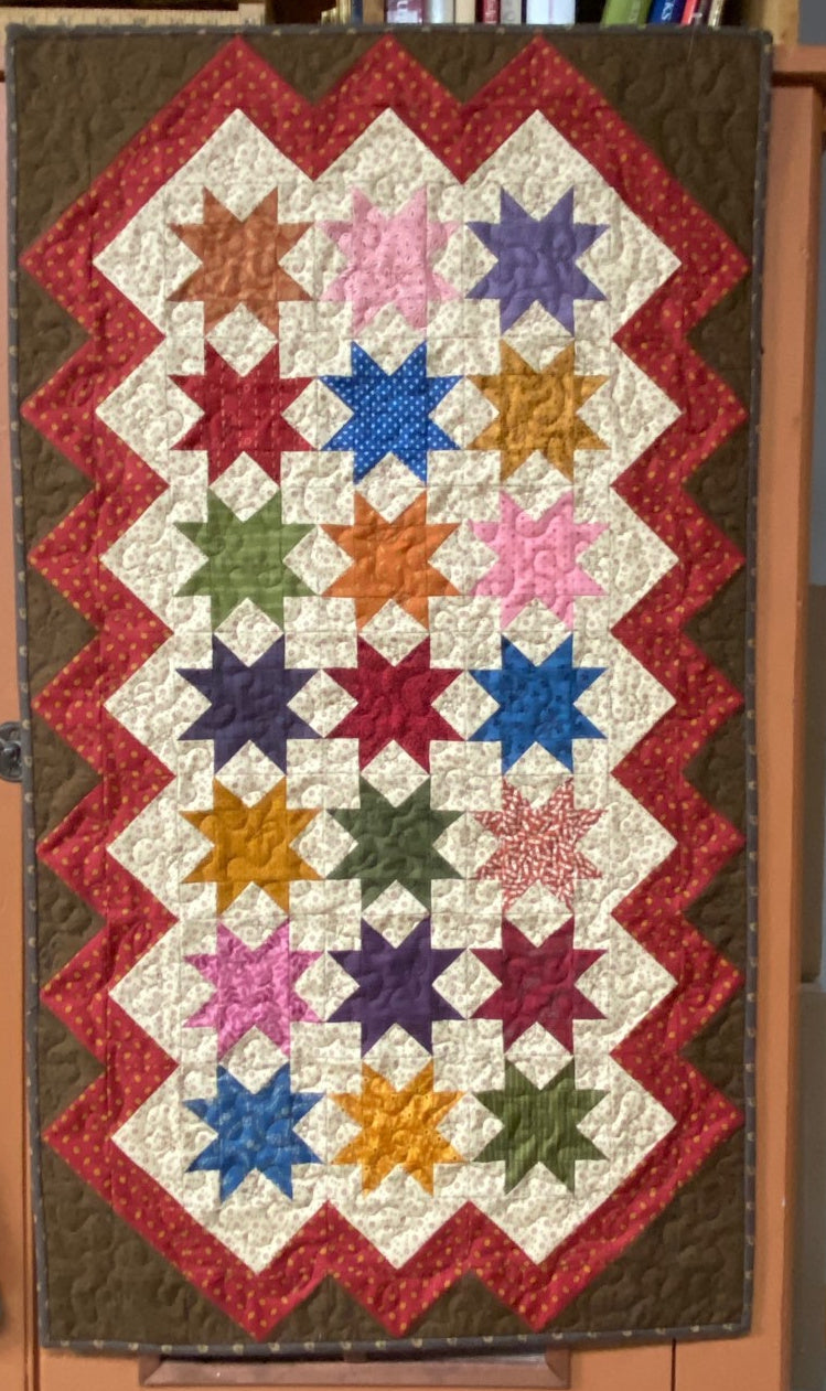 Skylight scrappy table runner quilt pattern designed by Deanne Eisenman for Snuggles Quilts